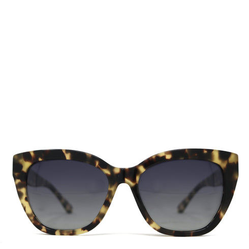 Sunglasses with tortoiseshell frame and dark lenses on a white background